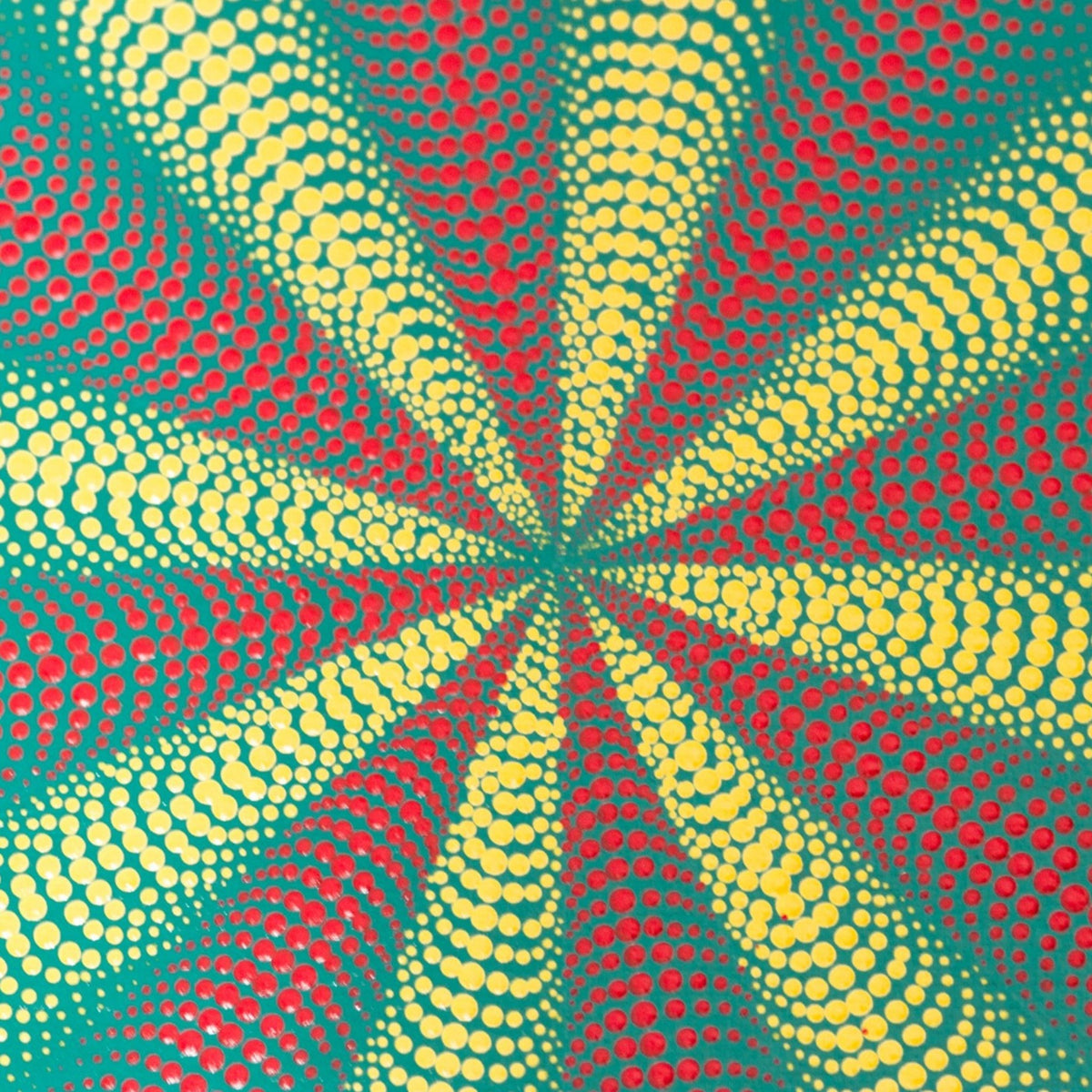 detail of red yellow white dot mandala on green background
