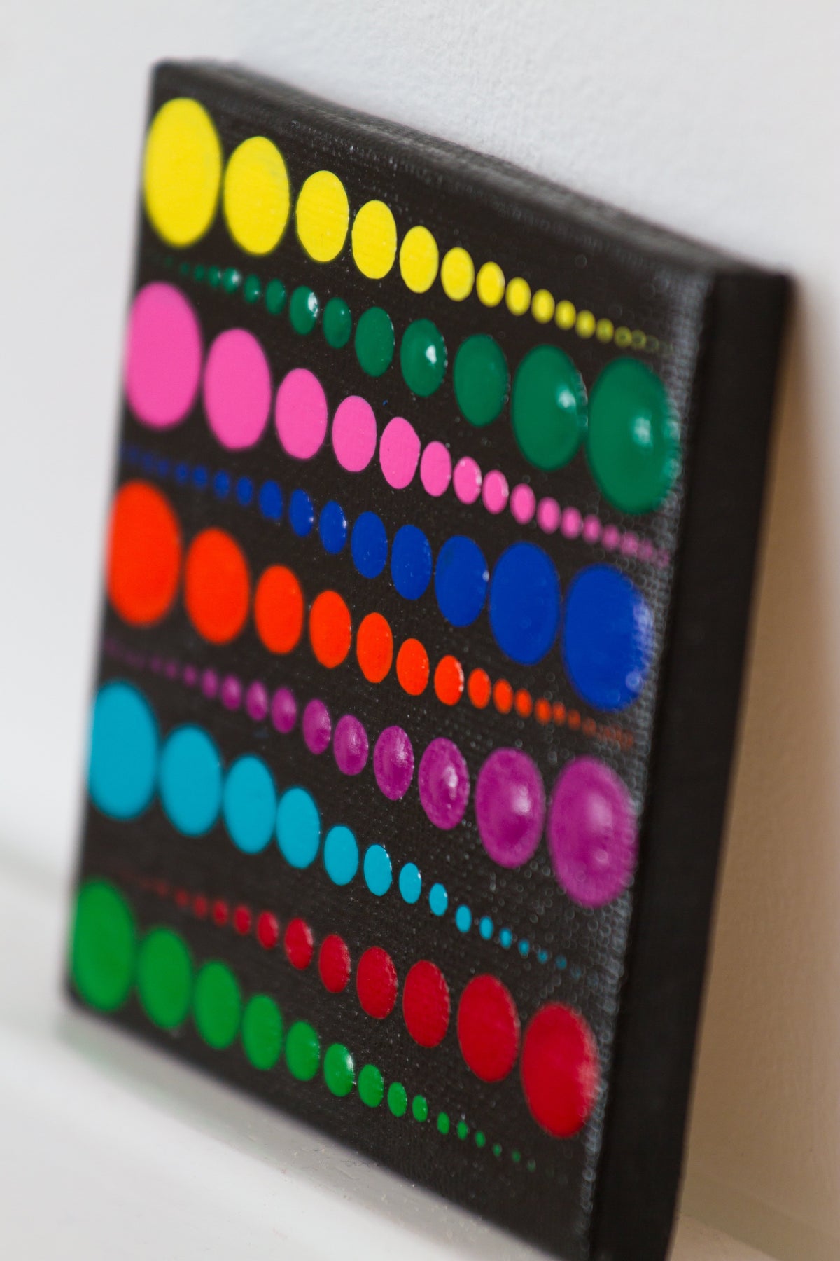 Small colourful dot painting yellow green pink blue orange ppurple red