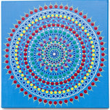 Colourful dot mandala on blue background, red yellow green purple white