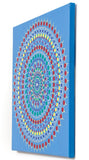 Colourful dot mandala canvas,  red yellow green purple white, on blue background