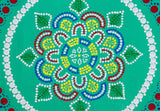 Dot mandala detail, red green yellow blue on green background
