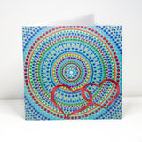 Colourful dot Mandala greeting card with red hearts