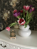 Mini green orange black bronze dot mandala by vase