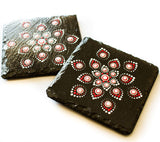 Black slate coasters decorated with red white silver dots