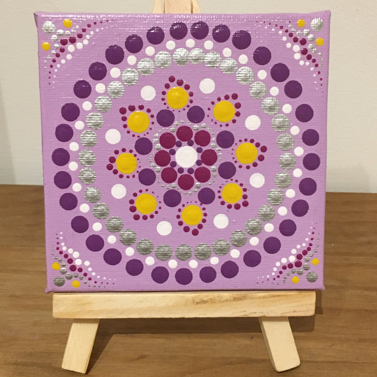 Small dot Mandala with easel purple yellow white silver