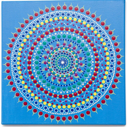 Colourful dot mandala on blue background, red yellow green purple white