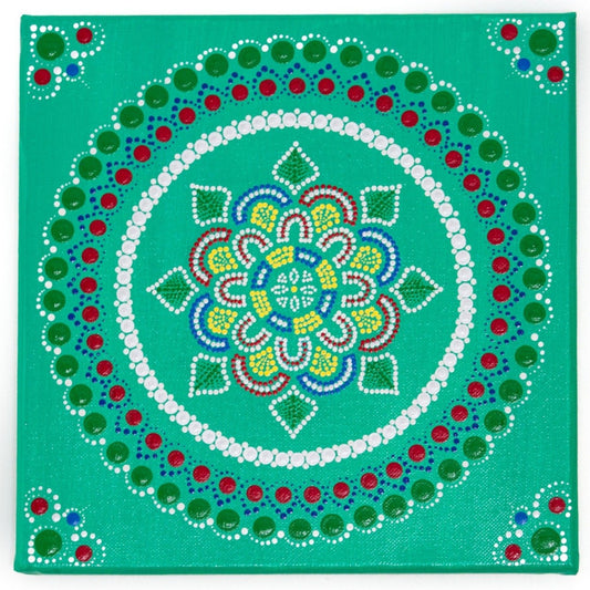 Dot mandala, red green yellow blue on green background