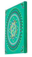 Dot mandala on canvas, red green yellow blue on green background