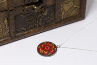 Red gold dotted mandala pendant with sterling silver chain