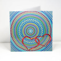 Colourful dot Mandala greeting card with red hearts