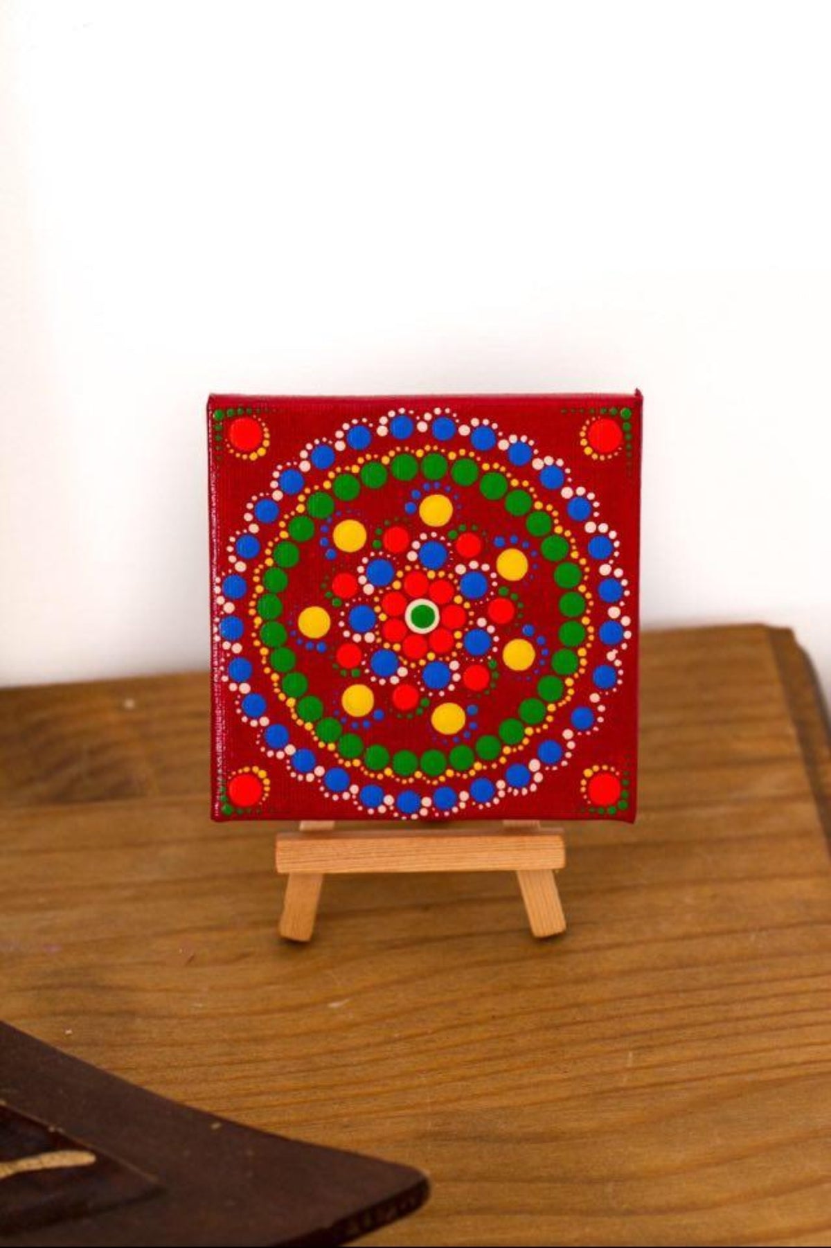 Colourful mini dot mandala on mini easel red yellow green orange white