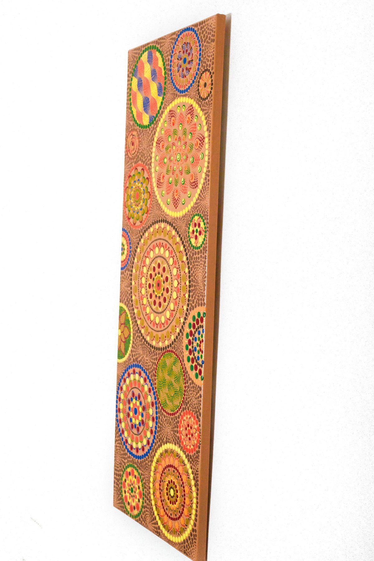 Long large colourful dot Mandala on peach colour background 