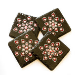 Black slate coasters decorated with red white silver dots