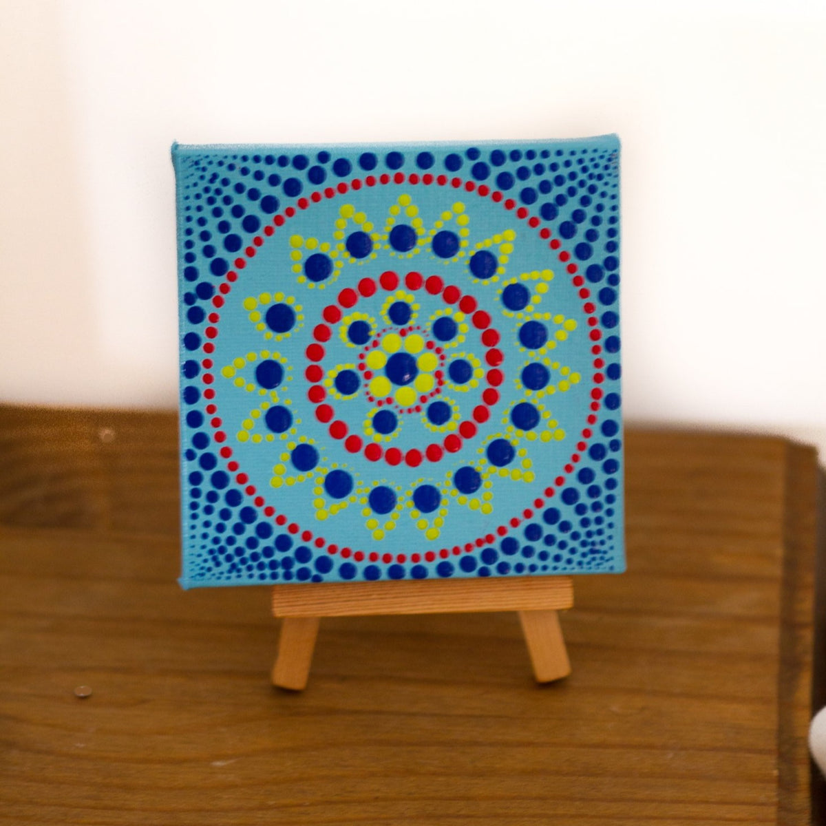 Small dot mandala with own easel blue red green